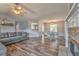 Open-concept dining area with modern lighting and wood-look flooring at 171 W Fork Way, Temple, GA 30179