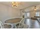 Open-concept dining area adjacent to the living room and fireplace at 171 W Fork Way, Temple, GA 30179