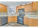 Functional kitchen with ample counter space and black appliances at 171 W Fork Way, Temple, GA 30179