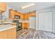 Well-lit kitchen with wooden cabinets and stainless steel appliances at 171 W Fork Way, Temple, GA 30179