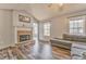 Cozy living room features a stone fireplace and hardwood floors at 171 W Fork Way, Temple, GA 30179