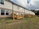 Townhome backyard featuring a lawn and a wooden deck at 312 Shine Dr, Stockbridge, GA 30281