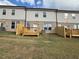 View of three backyard patios with privacy fences and freshly sodded lawns at 312 Shine Dr, Stockbridge, GA 30281