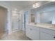 Bright bathroom featuring a shower and double sink vanity at 312 Shine Dr, Stockbridge, GA 30281