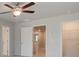 Bedroom with a ceiling fan and a walk-in closet for ample storage at 312 Shine Dr, Stockbridge, GA 30281