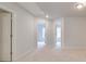 Upstairs hallway with neutral carpet and white trim at 312 Shine Dr, Stockbridge, GA 30281