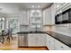 Kitchen area features stainless steel dishwasher and microwave, and a stainless steel sink at 5990 Somerset Ct, Suwanee, GA 30024