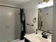 Modern bathroom with chrome fixtures, shower and glass door at 145 15Th St # Apt 1023, Atlanta, GA 30309