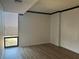 Relaxing bedroom with hardwood flooring, neutral walls, and a sunny window at 145 15Th St # Apt 1023, Atlanta, GA 30309