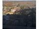 This is a view of the neighborhood with a large multi-story home in the center at 145 15Th St # Apt 1023, Atlanta, GA 30309
