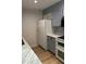 Bright kitchen features updated appliances, marbled countertops, and wood-look floors at 145 15Th St # Apt 1023, Atlanta, GA 30309