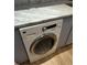 Convenient laundry room with marbled countertops and modern washer at 145 15Th St # Apt 1023, Atlanta, GA 30309