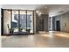 Modern lobby featuring tile floors, sculpture, and large windows at 145 15Th St # Apt 1023, Atlanta, GA 30309