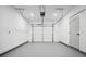 Clean, minimalist garage with bright lighting and smooth concrete flooring at 1570 Flat Shoals Se Rd # 7, Atlanta, GA 30316