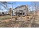 Backyard area with fire pit, string lights, and seating at 4391 Chatuge Dr, Buford, GA 30519