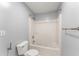 Clean bathroom featuring a toilet, tub-shower combo, and neutral tones, providing a functional and comfortable space at 4391 Chatuge Dr, Buford, GA 30519