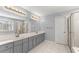 Bright bathroom features double sinks, ample vanity storage, and separate shower and tub at 4391 Chatuge Dr, Buford, GA 30519