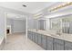 Bathroom with double vanity, shower, and tub visible through an open doorway, for a spa like feel at 4391 Chatuge Dr, Buford, GA 30519