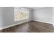 Serene bedroom with natural light, wood floors, and neutral paint at 4391 Chatuge Dr, Buford, GA 30519