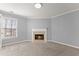 Cozy room with a fireplace providing comfort, complemented by a window offering natural light at 4391 Chatuge Dr, Buford, GA 30519