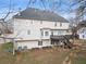 Back of house with walk out basement, wooden deck and neutral colored siding at 4391 Chatuge Dr, Buford, GA 30519