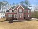 Charming brick home featuring a well-manicured lawn and inviting front entrance at 4391 Chatuge Dr, Buford, GA 30519