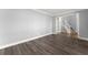 Modern living room features light walls and wood flooring at 4391 Chatuge Dr, Buford, GA 30519