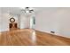 Bright bedroom featuring hardwood flooring, a wet bar, and a window offering natural light at 3811 Harts Mill Ne Ln, Brookhaven, GA 30319