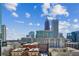 Beautiful city skyline featuring a mix of modern high-rises and charming historic buildings under a blue sky at 860 Peachtree Ne St # 1008, Atlanta, GA 30308