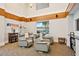 Cozy common area featuring comfortable swivel chairs, bookcase, and a small window at 860 Peachtree Ne St # 1008, Atlanta, GA 30308