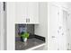 Stylish counter area with black tile backsplash and decorative plant at 860 Peachtree Ne St # 1008, Atlanta, GA 30308