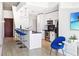 Well-lit kitchen with stainless steel appliances, breakfast bar, and contemporary design at 860 Peachtree Ne St # 1008, Atlanta, GA 30308