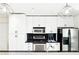 Bright kitchen features white cabinets, stainless appliances, and modern pendant lighting at 860 Peachtree Ne St # 1008, Atlanta, GA 30308
