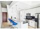 Kitchen featuring stainless steel appliances, white cabinets, and a breakfast bar at 860 Peachtree Ne St # 1008, Atlanta, GA 30308
