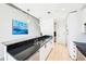 Kitchen featuring black granite countertops, stainless steel appliances, and modern pendant lighting at 860 Peachtree Ne St # 1008, Atlanta, GA 30308