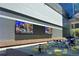 Outdoor seating area with large video screens and modern architecture at 860 Peachtree Ne St # 1008, Atlanta, GA 30308