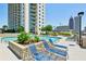 Outdoor pool area with lounge chairs, offering a relaxing urban retreat at 860 Peachtree Ne St # 1008, Atlanta, GA 30308