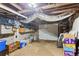 Unfinished basement with exposed ductwork and concrete floor, offering potential for customization at 1721 Clifton Se Way, Atlanta, GA 30316