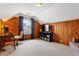 Charming bedroom featuring natural wood paneling, plush carpet, and plenty of natural light at 1721 Clifton Se Way, Atlanta, GA 30316