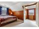 Cozy bedroom featuring wooden paneled walls, plush carpet, and large windows for natural light at 1721 Clifton Se Way, Atlanta, GA 30316