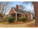 A charming brick house with a cozy screened-in porch and well-manicured landscaping at 1721 Clifton Se Way, Atlanta, GA 30316