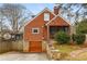 Charming brick home featuring an attached garage and a well-maintained yard at 1721 Clifton Se Way, Atlanta, GA 30316