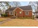 Charming brick home with a stone foundation, inviting entrance, and well-maintained front yard at 1721 Clifton Se Way, Atlanta, GA 30316