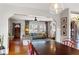 Open concept living room with hardwood floors, a gray couch and abundant natural light at 1721 Clifton Se Way, Atlanta, GA 30316