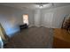 Empty bedroom featuring carpet, window, and a door to the hallway at 3124 Usher Nw St, Covington, GA 30014