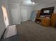 Carpeted bedroom with neutral walls, white trim, and multiple windows at 3124 Usher Nw St, Covington, GA 30014