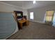 Carpeted bedroom with desk, large window, and neutral walls at 3124 Usher Nw St, Covington, GA 30014