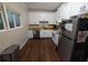 Bright kitchen with stainless steel appliances, white cabinets and butcher block countertops at 3124 Usher Nw St, Covington, GA 30014