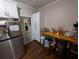 Kitchen featuring stainless steel refrigerator and a butcher block countertop with breakfast bar at 3124 Usher Nw St, Covington, GA 30014