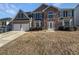 Charming two-story home featuring a two-car garage, stone accents, and a well-maintained lawn at 4906 Laythan Jace Ct, Snellville, GA 30039